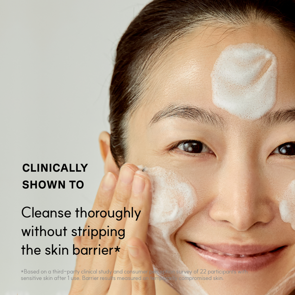 Woman cleansing with Golden Jojoba micro-bubble foam, clinically shown to cleanse thoroughly without stripping the skin barrier